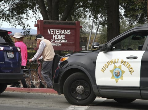 People walk to the information center at the Veterans Home of California in Yountville, Calif., on Friday March 9, 2018. A gunman took at least three people hostage at the largest veterans home in the United States on Friday.